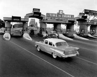 Traffic flowing smoothly on the Sydney Harbour Bridge after two new lanes were opened, July 1959.